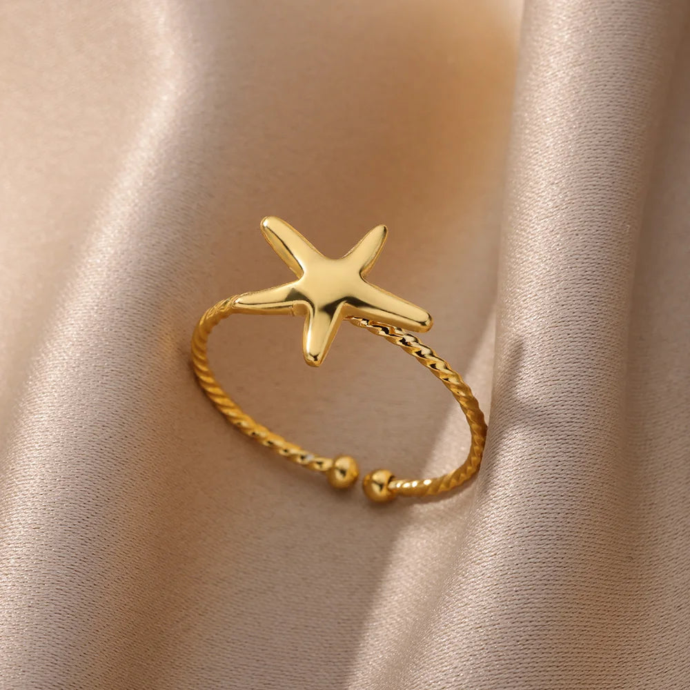Stella Nova Rings – Adjustable Gold-Tone Stainless Steel with Star & Shell