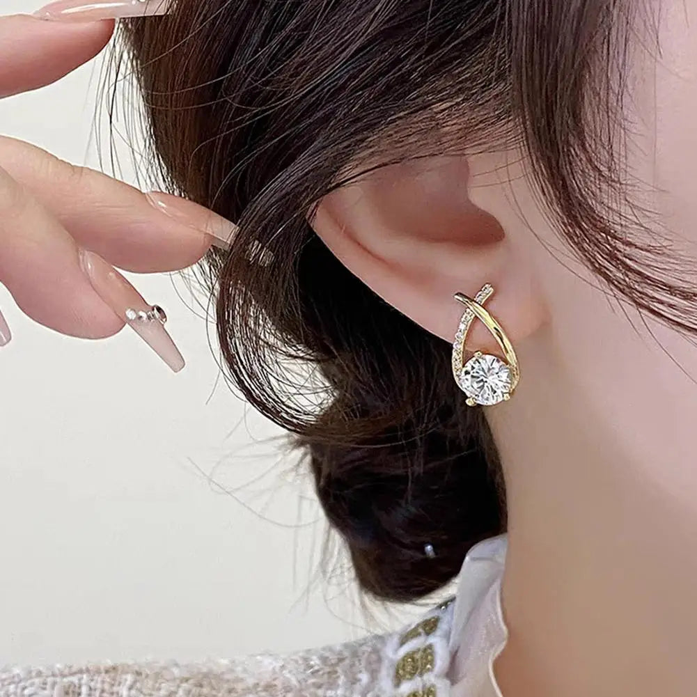 ELEGANT SHINE CROSS STUD Earrings