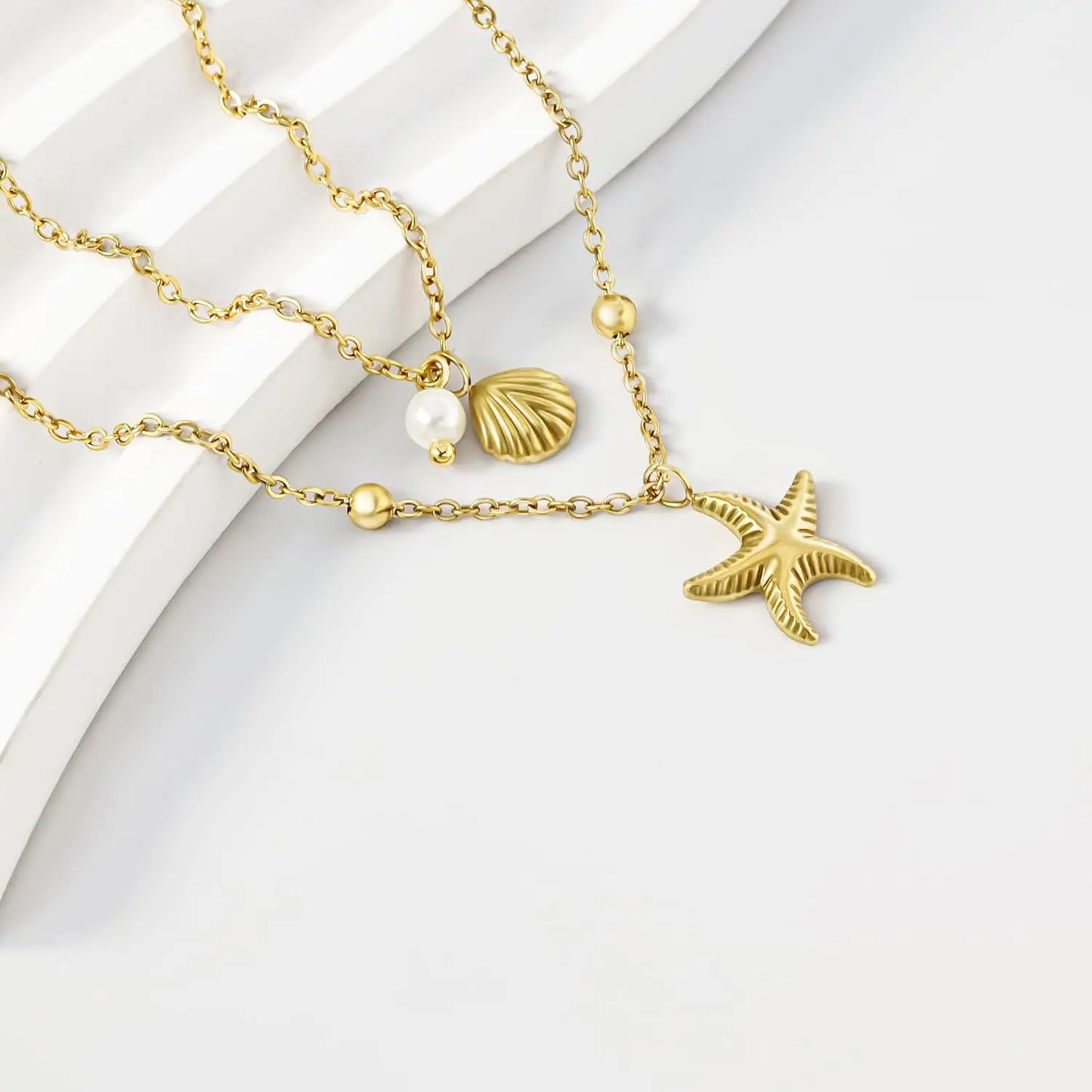 Coastal Charm Necklace – 14K Gold Plated Layers with Starfish, Conch & Pearl Accents
