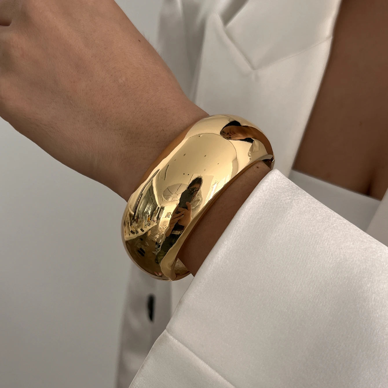 Chunky Gold Spring Bangle – Statement Metal Bracelet