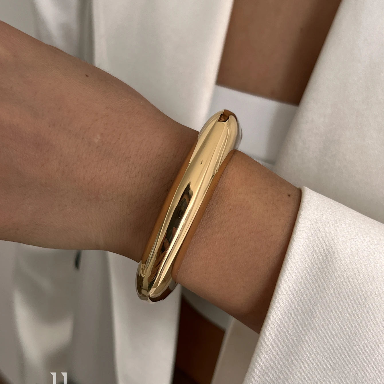 Chunky Gold Spring Bangle – Statement Metal Bracelet