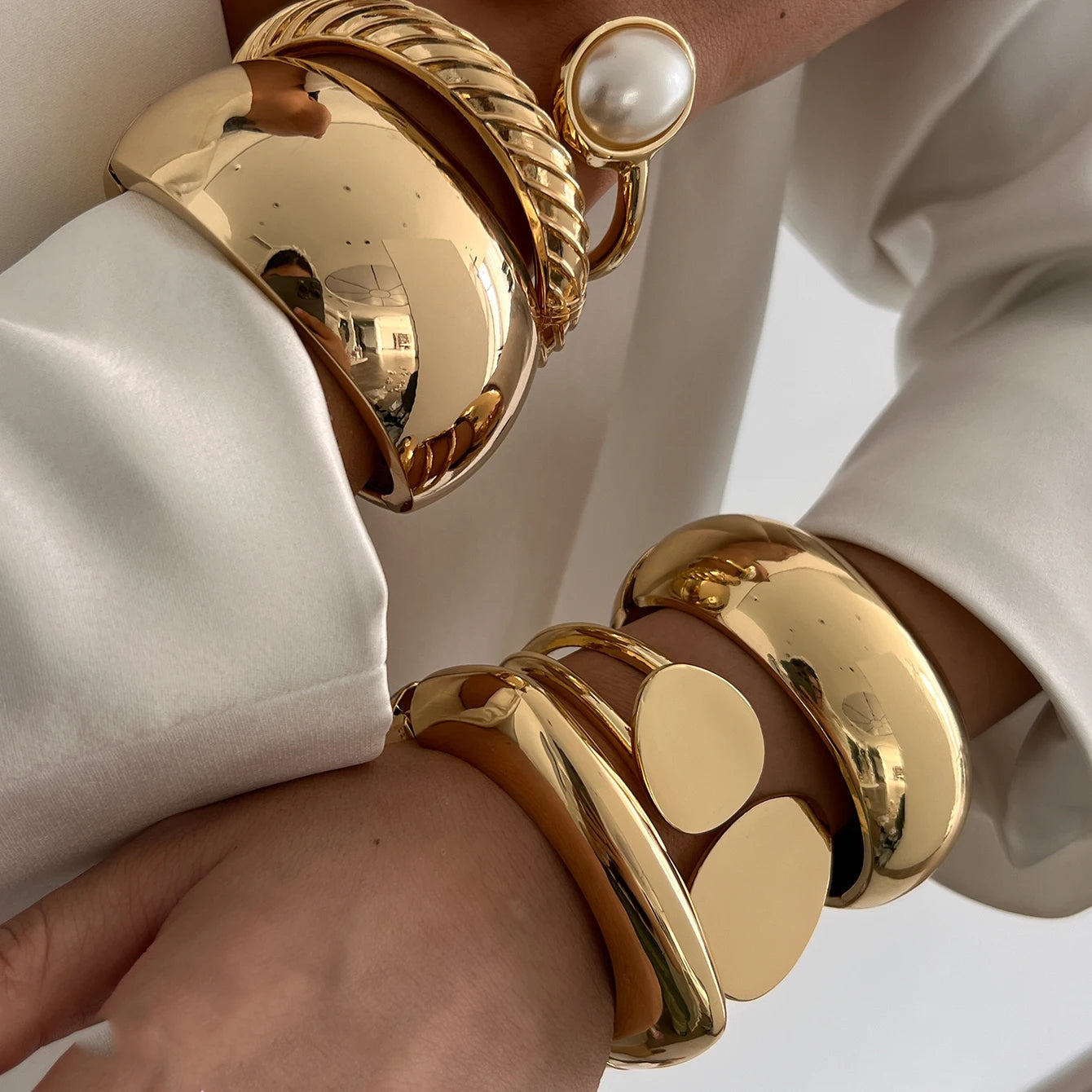 Chunky Gold Spring Bangle – Statement Metal Bracelet